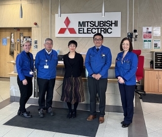 Deputy Consul General Ishii with Mitsubishi staff.