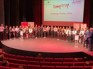 Participating students line up for award ceremony on stage