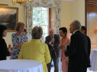Participants laughing and chatting with Her Imperial Highness (Middle Right)