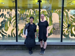 In front of Sebastian Thomas’s new work “A New Face In Hell”, from left, Deputy Consul Ishii & Ms. Simpson of ESW.